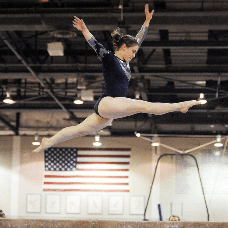 short gymnast leap on beam